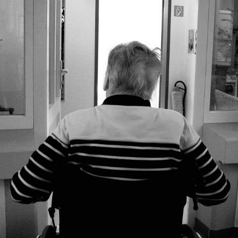Elderly man sat in a wheelchair